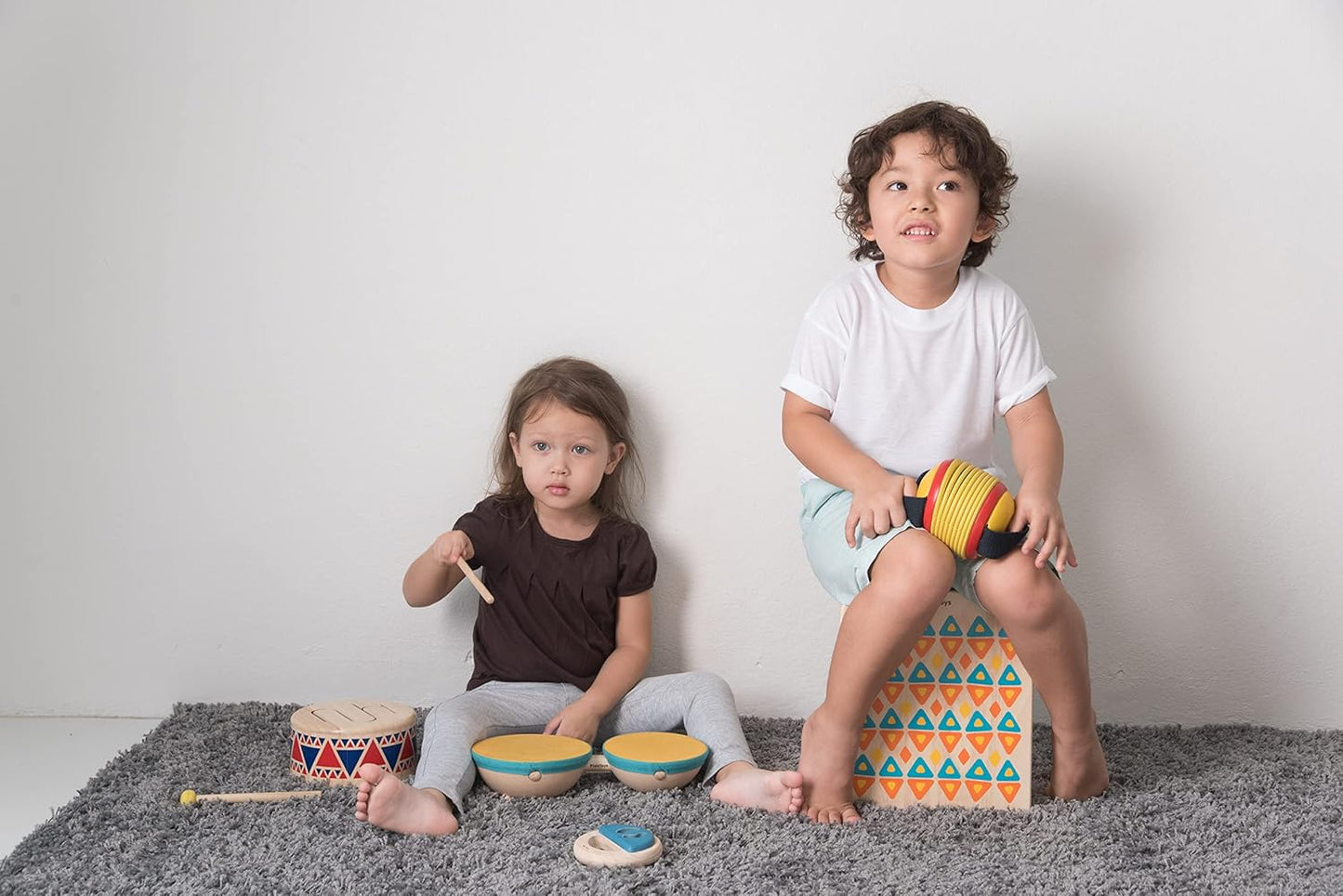 PlanToys Toddler Musical Instruments - Double Drum Set with Drumsticks, Made with Natural Rubber-Coated Fabric and Rubberwood for Motor Skills Development (Orange)