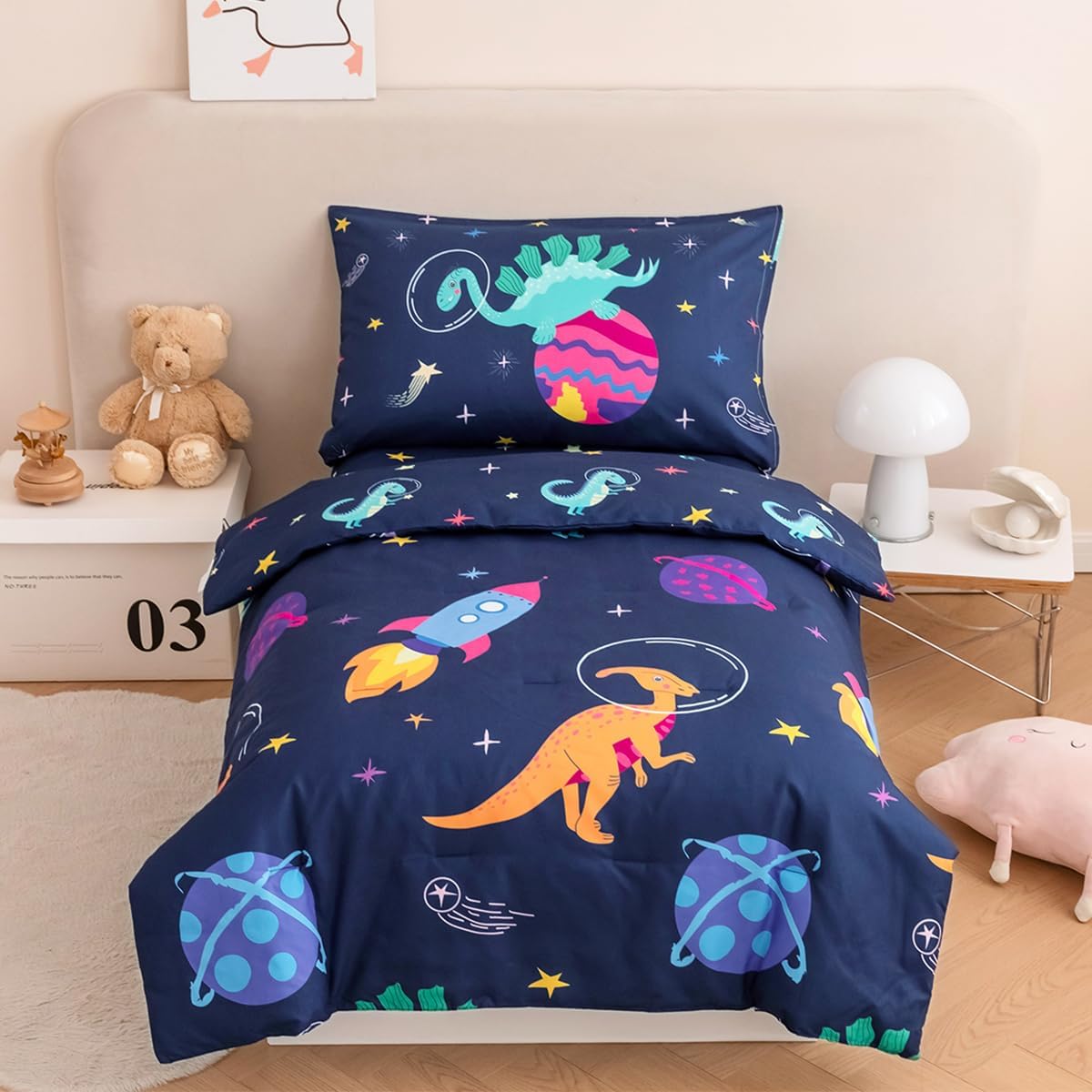 PERFEMET Toddler Bedding Set 4 Pieces Cartoon Dinosaur Planet Printed Bed in A Bag for Boys Girls Reversible Navy Blue Toddler Comforter with Sheet Set for All Season(Navy, Dinosaur/Planet/Rocket)