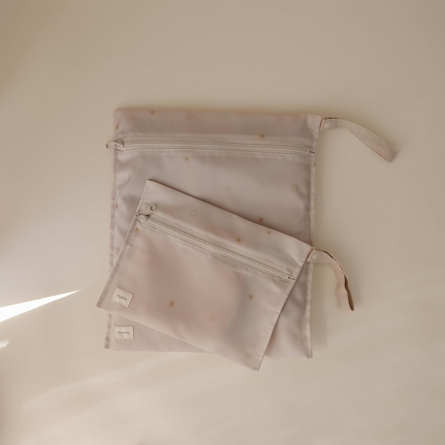 mushie Water Resistant Wet Bags | Large & Small Reusable Storage Bag for Baby Items and Travel | Zippered Pockets with Handle | Machine Washable, Set of 2 (Sun)