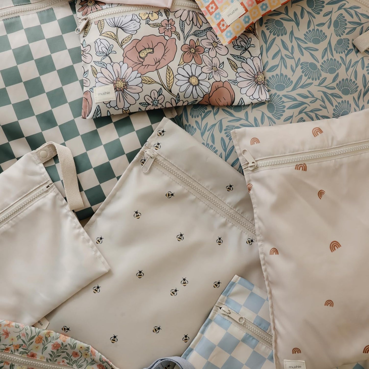 mushie Water Resistant Wet Bags | Large & Small Reusable Storage Bag for Baby Items and Travel | Zippered Pockets with Handle | Machine Washable, Set of 2 (Happy Flowers Check)